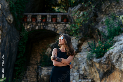 Girl in black dress and glasses posing  © innadril
