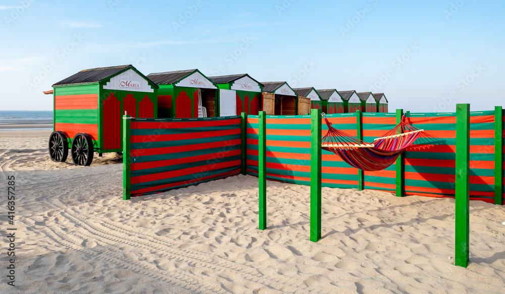 Vintage green and red hammock, windbreaker and beach huts