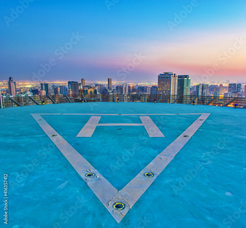 Helipad shot for a city and buildings at sunset