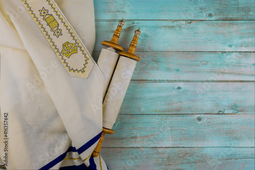 Day of jewish holidays symbols prayer shawl tallit, prayer torah scroll book photo