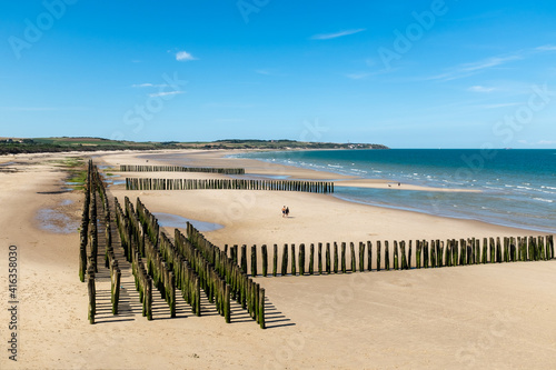 Mussel poles on the beach of Wissant on the Opal Coast in France photo