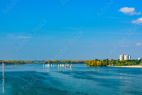 Many yachts at the river Dnieper on autumn in Kremenchug, Ukraine. Sailing regatta