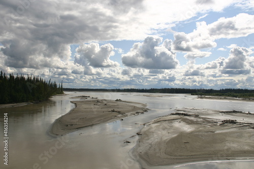 The Tanana and Chena River Meeting and Confluence near Fairbanks Alaska forming Deposition Delta with Amazing Dramatic Clouds photo