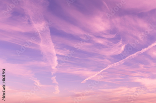 Dramatic sunrise, sunset pink violet blue sky with clouds abstract background texture