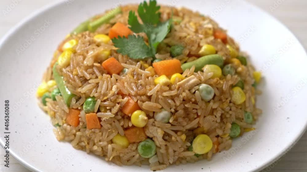 fried rice with green peas, carrot and corn - vegetarian and healthy food style fried rice with green peas, carrot and corn - vegetarian and healthy food style