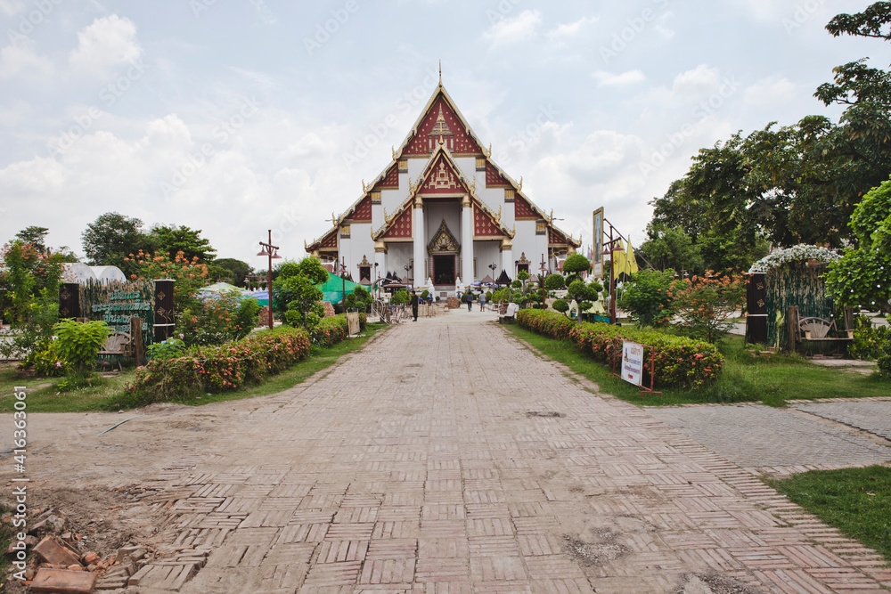 AYUTTHAYA, THAILAND - MAY 25, 2018: Ayutthaya Historical Park in Ayutthaya (second capital of the Siamese Kingdom). A very popular destination for day trips from Bangkok. Wihan Phra Mongkhon Bophit.