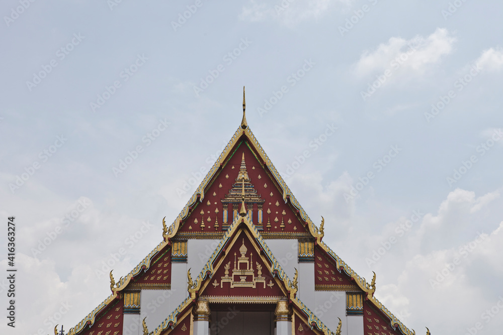 AYUTTHAYA, THAILAND - MAY 25, 2018: Ayutthaya Historical Park in Ayutthaya (second capital of the Siamese Kingdom). A very popular destination for day trips from Bangkok. Wihan Phra Mongkhon Bophit.