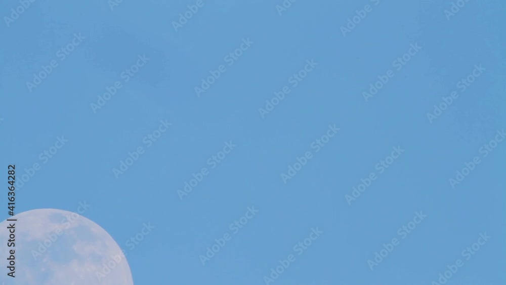 The full moon travelling on the sky in the dusk - timelapse The full moon travelling on the sky in the dusk - timelapse