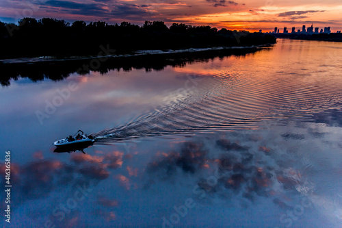 boat at sunset in Warsaw, Poland, on the Vistula River