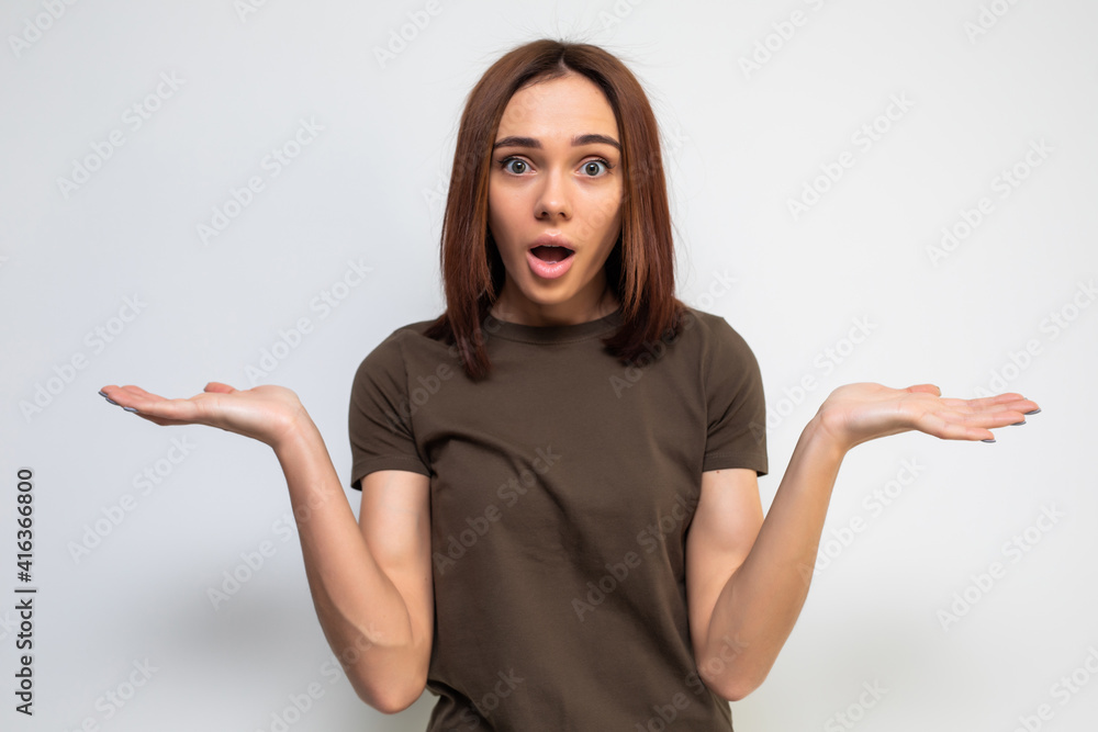 Unsure woman with shrug and hands out gesturing uncertainty isolated on white background Unsure woman with shrug and hands out gesturing uncertainty isolated on white background