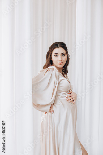 Image of a beautiful young pregnant emotional woman