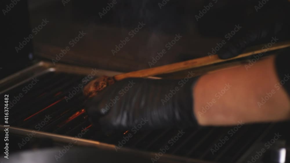 Closeup shot of grilled meat in barbecue griller. Preparing Delicious Grilled meat.