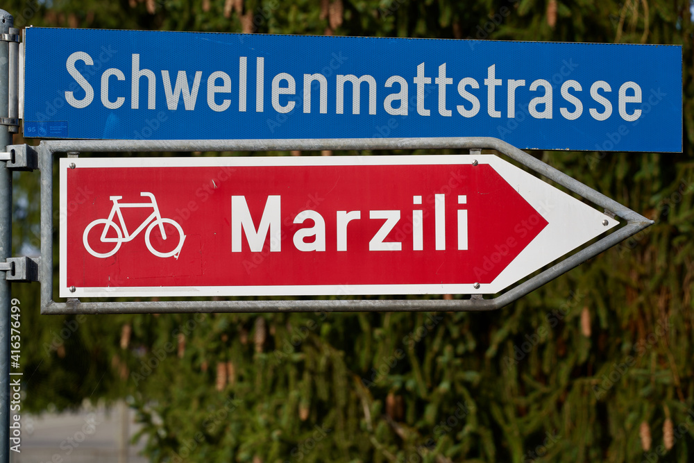 Sign for bicycle lane to the city district called Marzili at Bern, capital of Switzerland. Sign for bicycle lane to the city district called Marzili at Bern, capital of Switzerland.