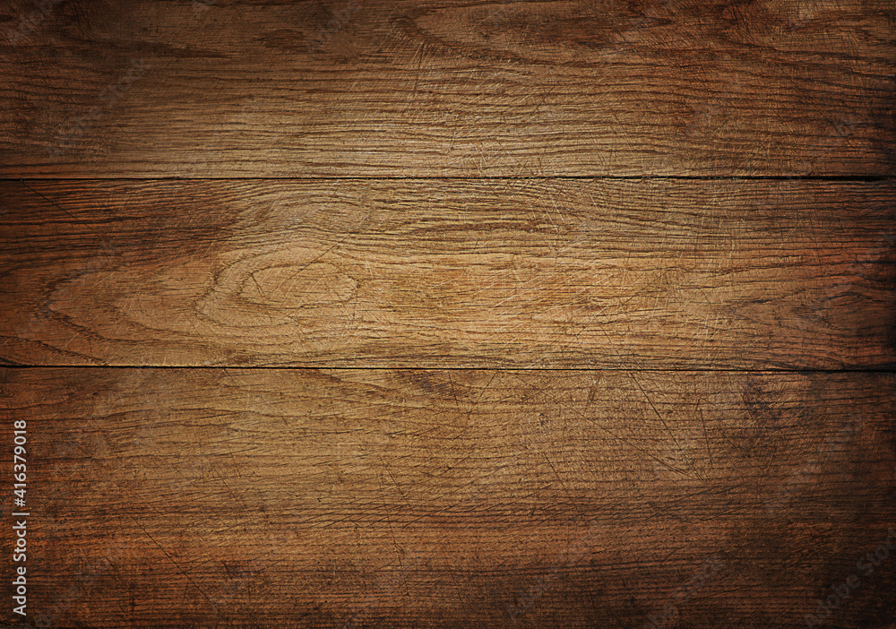 Brown scratched wooden cutting board. Brown scratched wooden cutting board.