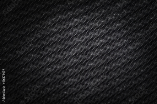 Texture technical fabric with rubber coating. Black background.