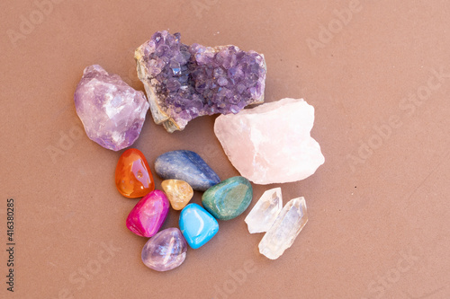 Healing crystals on brown background