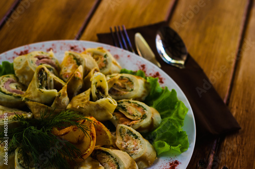 tender fried pancake stuffed with mushroom meat and herbs with sauce