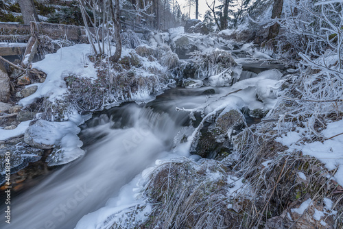 Ramsaubach creek near Ramsau ski town in Austria in frosty morning