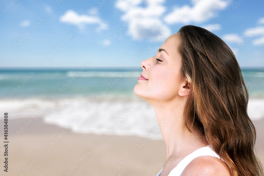 Outdoor summer portrait of pretty young smiling happy woman posing Outdoor summer portrait of pretty young smiling happy woman posing