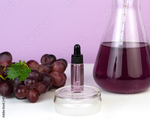 Organic bio grape cosmetics. Extract, grape seed oils, serum. Abstract cosmetic laboratory. photo