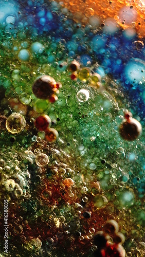 Colorful oil bubbles with tablet backlight
