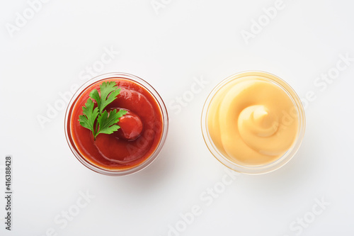 Tomato ketchup tasty and delicious mayonnaise in glass bowl isolated on white. Mock up. Isolated on white background.