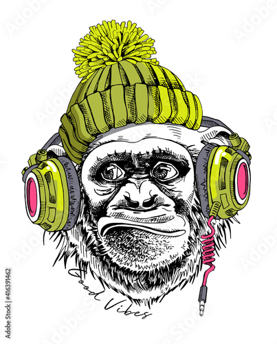 Funny Monkey in a hipster green knitted hat and in a headphones. Good vibes - lettering quote. Humor card, t-shirt composition, hand drawn style print. Vector illustration.