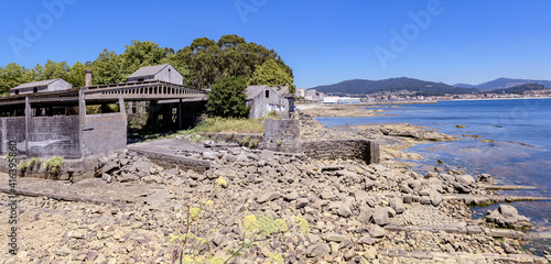 ruined building where whales were taken after they were hunted in the sea with remains of rails to bring them ashore