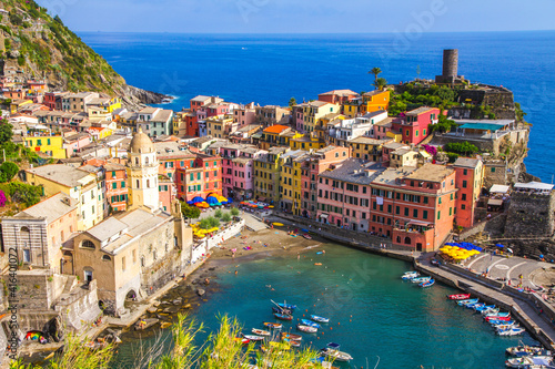 Colorful villages in Cinque terre, Italy and seascape at sunset photo