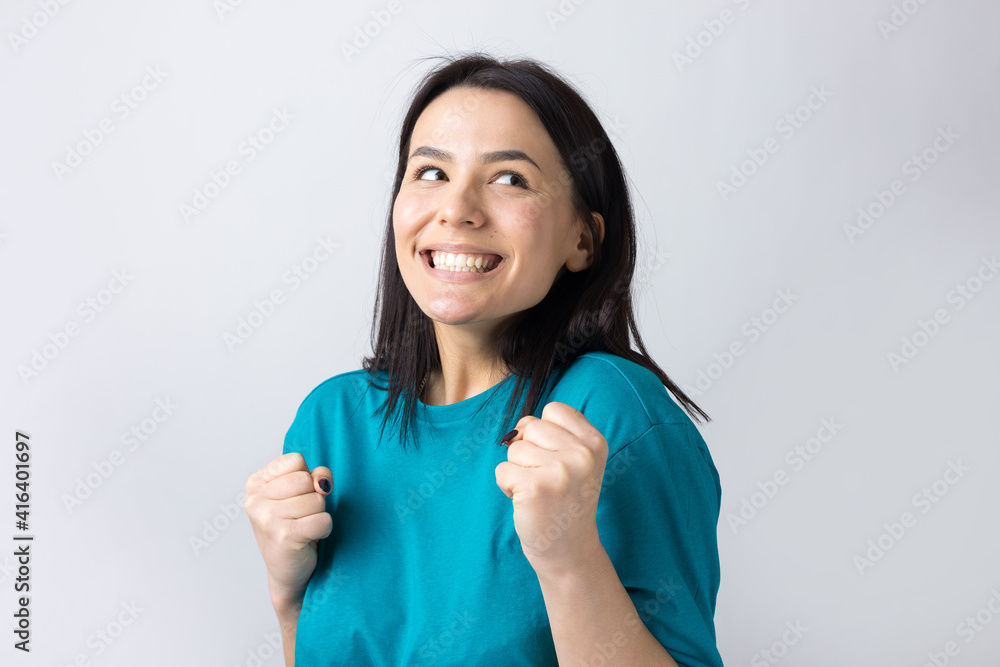 Close up portrait of attractive shouting in winning smiling with raised fists young she her girl wearing jeans shirt clothes isolated on grey background Close up portrait of attractive shouting in winning smiling with raised fists young she her girl wearing jeans shirt clothes isolated on grey background