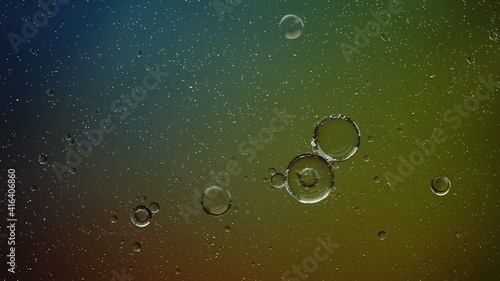 Oil bubbles in the water with some gradient backlight