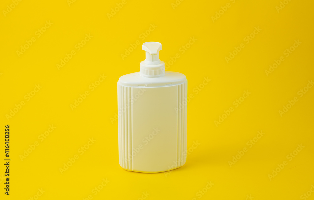 blank packaging white cosmetic cream or soap pumping bottle isolated on yellow blank packaging white cosmetic cream or soap pumping bottle isolated on yellow