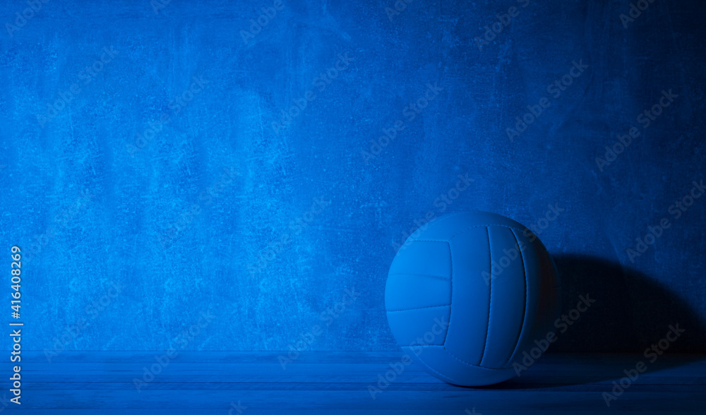 Volleyball ball isolated on black background. Blue neon Banner Art concept
