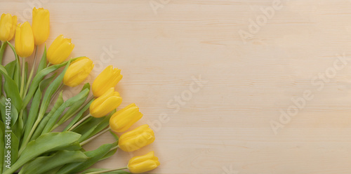 spring yellow tulips on wood stock phototulpan photo