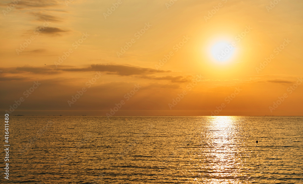 Amazing Sunset on the Sea. Adriatic sea, beautiful sunset, waves and landscape.  Lignano Sabbiadoro, Italy.