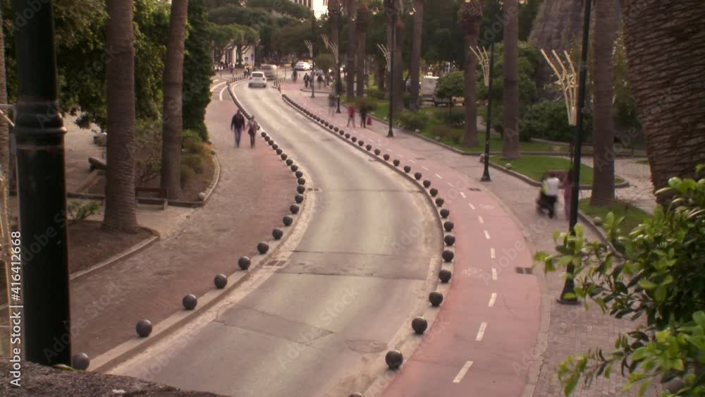 Kos Greece time-lapse by people and cars on the road in the center between the antiquities Kos Greece time-lapse by people and cars on the road in the center between the antiquities