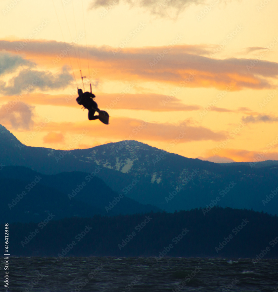 silhouette of a kite surfer