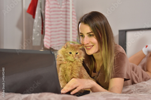 Brunette business woman with red cat indoor