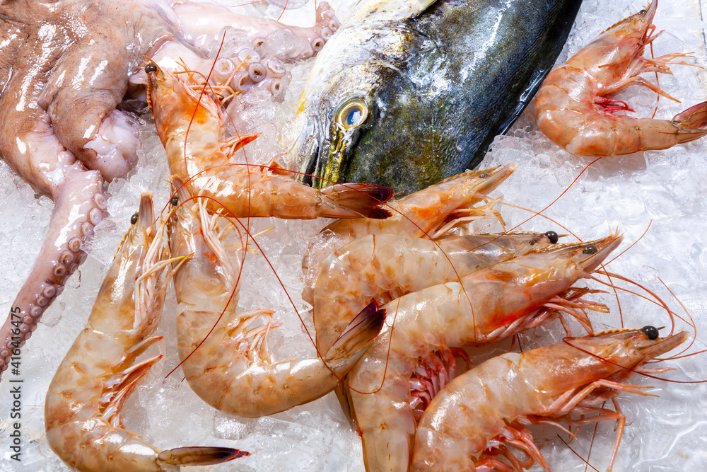 Seafood on ice at the fish market, fishmonger
