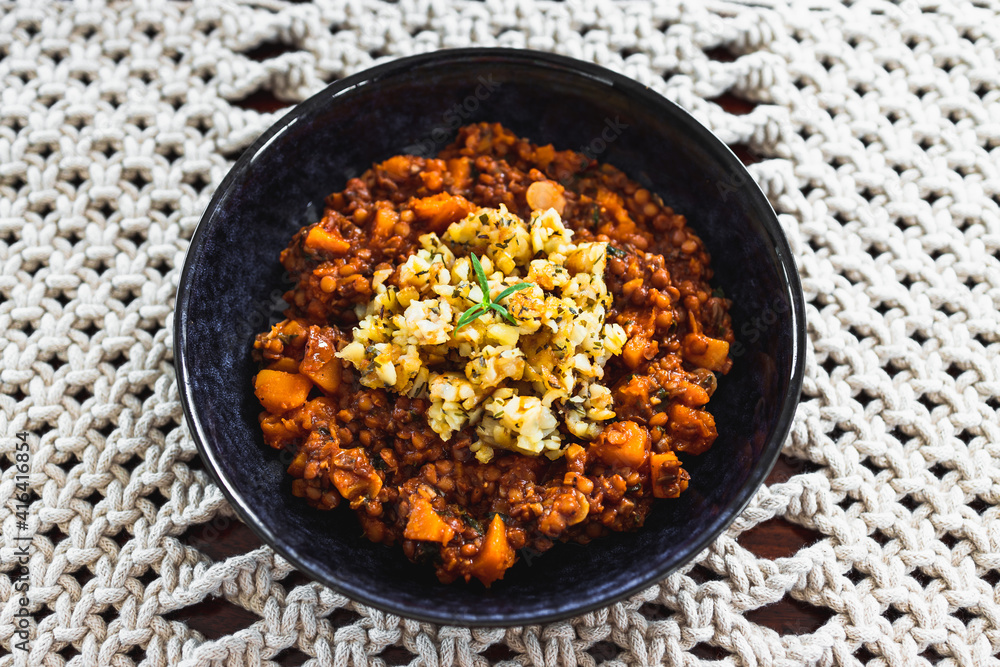 vegan pumpkin lentil and mushroom curry with truffle potato topping, healthy plant-based food