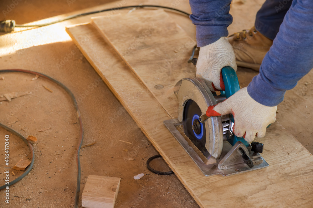 Cutting plywood using an electrical chain saw professional tools Cutting plywood using an electrical chain saw professional tools