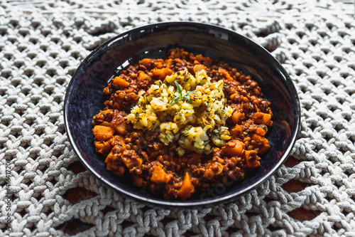 vegan pumpkin lentil and mushroom curry with truffle potato topping, healthy plant-based food