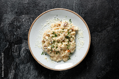 Tableau sur toile risotto with seafoods (shrimps, mussels, octopus, clams) and tomatoes