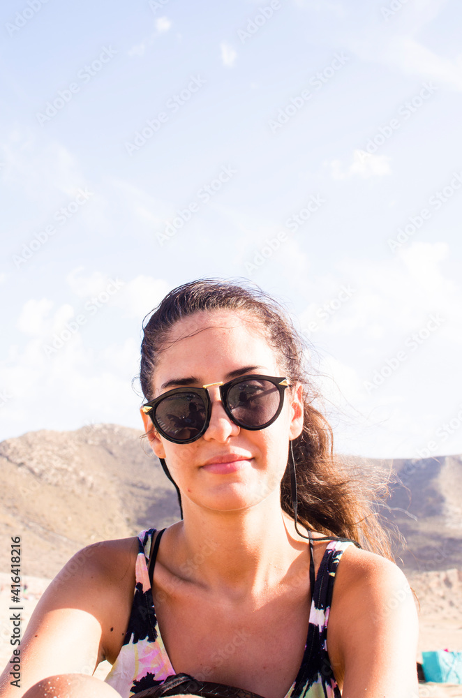 portrait of young long-haired woman wearing sunglasses outdoors portrait of young long-haired woman wearing sunglasses outdoors