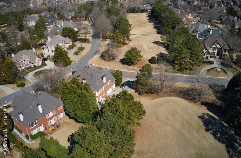 Aerial panoramic view of house cluster in an upscale sub division with golf course and lake in suburbs of Georgia,USA