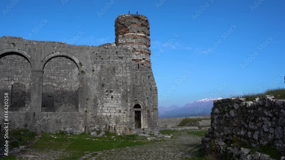Quiet alleys through stone walls of ancient buildings inside Rozafa castle in Albania Quiet alleys through stone walls of ancient buildings inside Rozafa castle in Albania