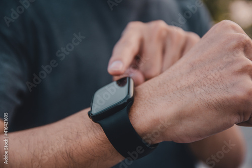 Man use smart watch in running