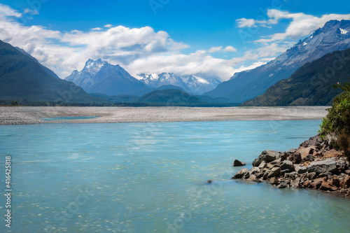 Dart River view with snow-capped mountains in the background at Isengard Lookout, a very remote location on Kinloch-Glenorchy Road in New Zealand, South Island.