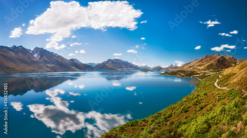 Breathtaking View from a famous scenic Lookout at Lake Wakatipu on one of the most scenic drives in New Zealand that connects Queenstown with Glenorchy, a popular touristic destination.