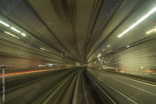Night city blur from train, Tokyo, Japan
